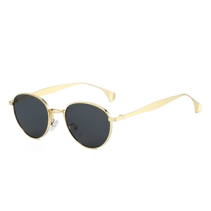 Lunettes de soleil ovales rétro en métal avec monture dorée et verres foncés chic