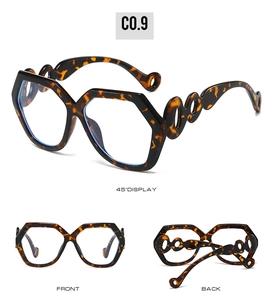 Detail view of tortoiseshell hexagonal sunglasses with hollow circular temple joints