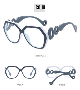 Detail view showing black and white geometric sunglasses with hollowed-out temples and C0.10