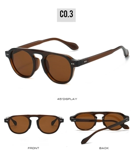 Detailansicht der runden Bernstein-Sonnenbrille mit Metallnieten und dunklen Gläsern