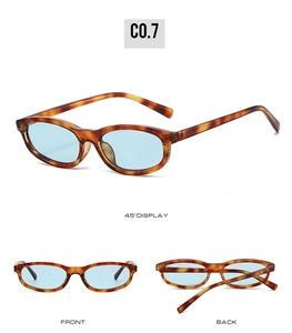Three-way view of tortoise shell oval sunglasses with light blue lenses and C0.7 code