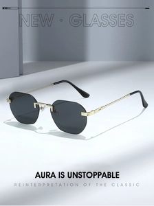Detail of rimless octagonal sunglasses featuring textured gold metal temples and dark lenses