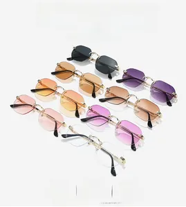 Detail view of rimless sunglasses in eight gradient colors with gold metal frames