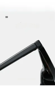 Macro detail of high-gloss black sunglasses showing flexible hinges and premium texture