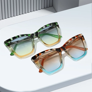 Fashionable oversized cat-eye sunglasses with tortoiseshell frames and gradient lenses