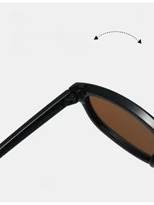 Macro shot of durable metal hinge details on high-quality black sunglasses