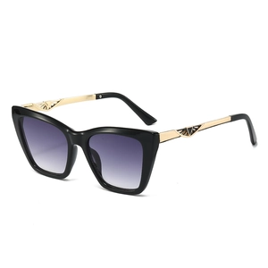 Chic black cat-eye sunglasses for women with gold hollow temples and purple gradient lenses