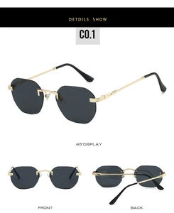 Detail view of rimless sunglasses with gold twisted metal temples and dark grey lenses
