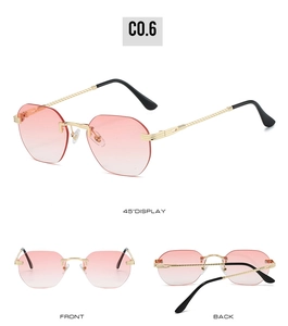 Detail of pink gradient rimless sunglasses with twisted gold metal temples and sharp view