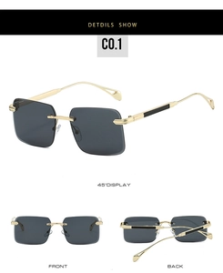 Detail view of rimless square sunglasses with gold metal temples and gray lenses