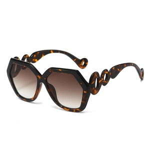 Stylish oversized hexagonal sunglasses with tortoiseshell frames and wave-hollow temples