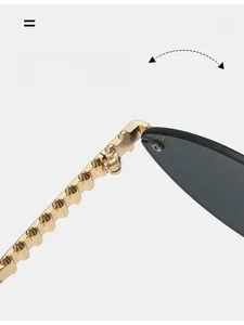 Detail of durable golden metal texture hinge and wavy temple on cat-eye sunglasses