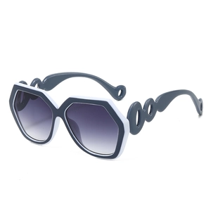 Fashionable oversized hexagonal sunglasses with grey and white frame and gradient lenses