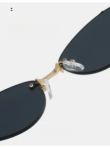 Close-up of golden metal bridge and soft silicone nose pads on cat-eye sunglasses