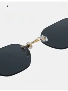 Detail of comfortable silicone nose pads and golden bridge on rimless sunglasses
