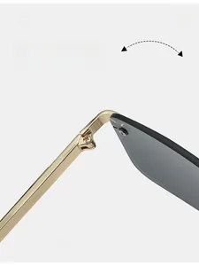 Detail of durable textured metal hinge on rimless sunglasses with cross screw fixings