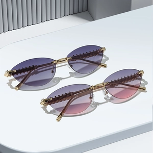 Chic rimless cat-eye sunglasses with gradient lenses and textured metal temples