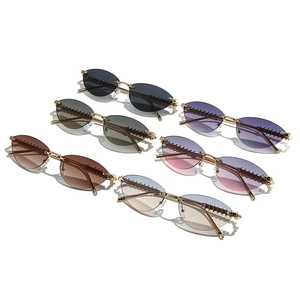Collection of trendy rimless cat-eye sunglasses with punk style textured metal temples