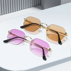 Fashionable rimless geometric sunglasses with tinted gradient lenses and gold metal temples