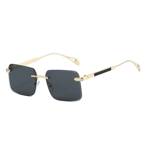 Frameless square sunglasses with gold metal temples and dark lenses in 45-degree view