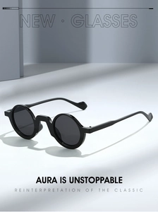 Retro black round frame sunglasses with thick rims shown against a minimalist geometric background