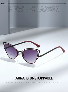 Detail of cat eye sunglasses featuring black and red double-line metal frame and gradient lenses