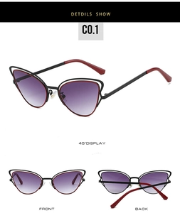 Detailed view of cat eye sunglasses with purple gradient lenses and black metal frames