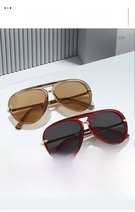 Close-up of retro aviator sunglasses with brown and grey UV protection lenses