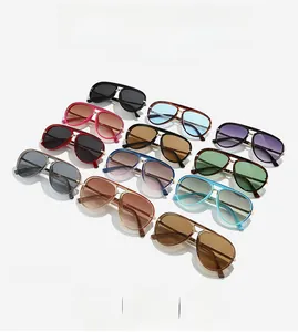 Flat lay view of multiple colored aviator sunglasses with metal frames and gradient lenses