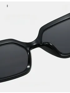 Macro detail of comfortable integrated nose pads on glossy black square sunglasses