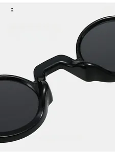 Detail of comfortable integrated nose pads on black round frame sunglasses for women