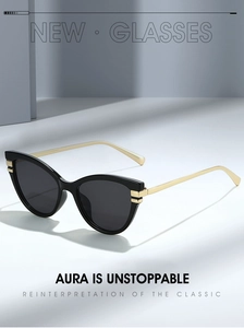 Detail of cat eye sunglasses featuring black frames and elegant slim gold metal temples