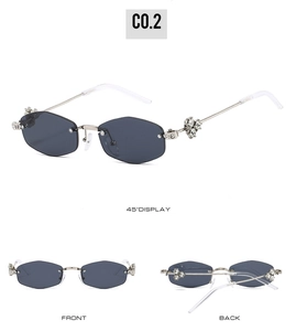 Detail view of rimless hexagonal sunglasses with luxury rhinestone clover metal temple