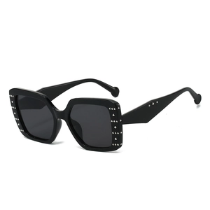 Black square frame sunglasses for women with silver metal rivets and grey lenses
