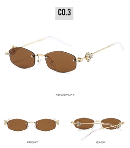 Detailed views of rimless hexagonal sunglasses with gold metal rhinestone floral hinges