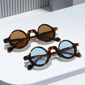 Vintage small round sunglasses with tortoiseshell frames and colored lenses for women