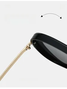 Detail of durable gold metal hinge connecting black frame and slim metal temple