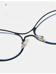 Macro detail of comfortable silicone nose pads on irregular metal anti-blue light glasses