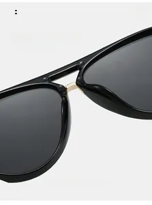 Detail of comfortable nose pads on black pilot sunglasses with gold metal accents