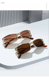 Detail of Y2K sunglasses featuring intricate hollowed-out metal temples and gold frames