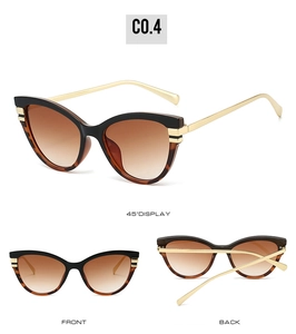 Cat eye sunglasses detail with black and tortoiseshell frames and gold metal temples