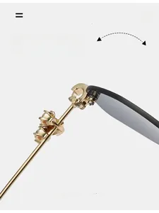 Detail of durable gold metal hinge with inlaid crystals on luxury rimless sunglasses