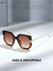 Detail of oversized hexagonal sunglasses with metal temples on minimalist stairs