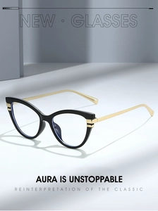 Detail of cat-eye glasses frame featuring black acetate front and gold metal temples