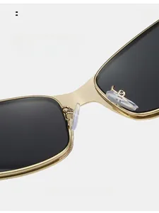 Close-up of golden metal bridge and comfortable soft silicone nose pads on Y2K sunglasses