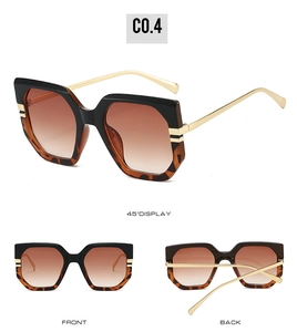 Detail view of large square vintage sunglasses with leopard print and gold metal temples
