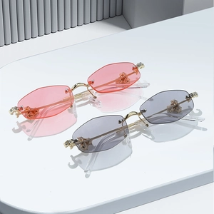 Luxury rimless polygon sunglasses with diamond accents and gold metal temples in two colors