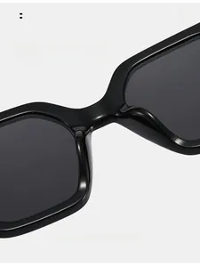Detail of thickened integrated nose pads on black square oversized sunglasses for comfort