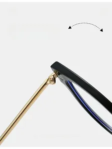 Macro shot of durable gold metal hinge and polished black frame on fashion glasses