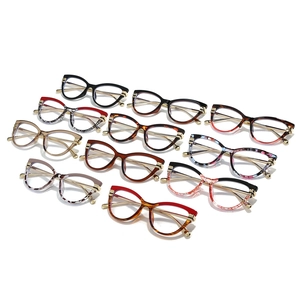 Cat eye glasses frames collection with metal temples in multiple colors and patterns